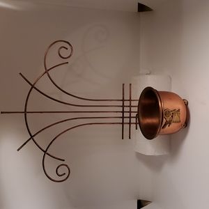 Copper pot with spinning wheel and hanger.